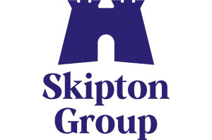 Dark purple icon representing a castle with the text Skipton Group below